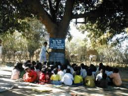 A typical school running under a tree in remote Bharat