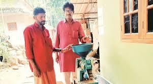 A farmer with a mini rice mill