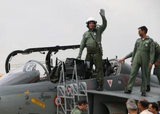 Union Minister for Defence, Rajnath Singh after his maiden sortie in LCA Tejas with Air Vice Marshal Narmdeshwar Tiwari, at HAL Airport, Bengaluru on September 19, 2019